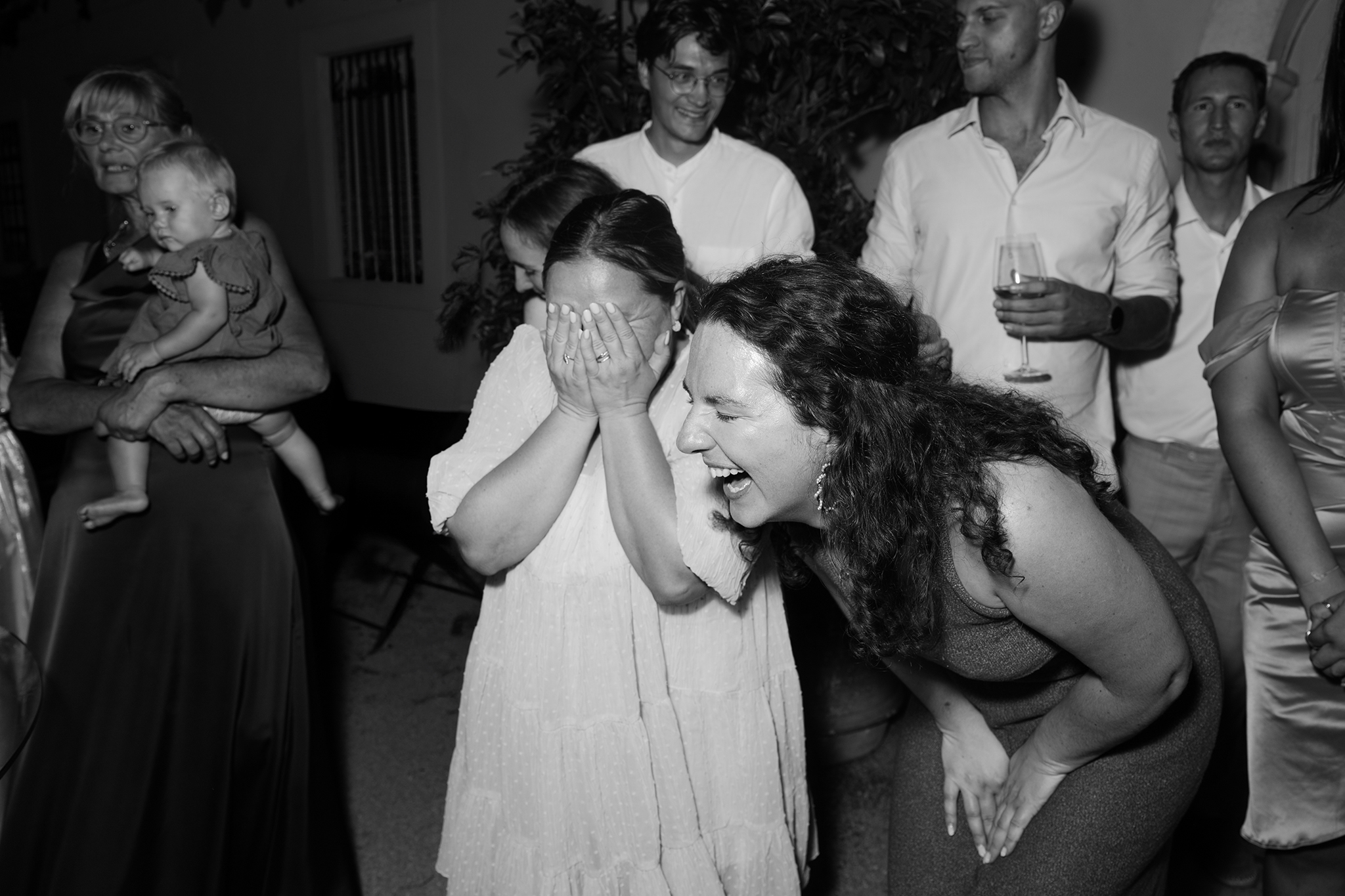 wedding guests laughing their hearts out